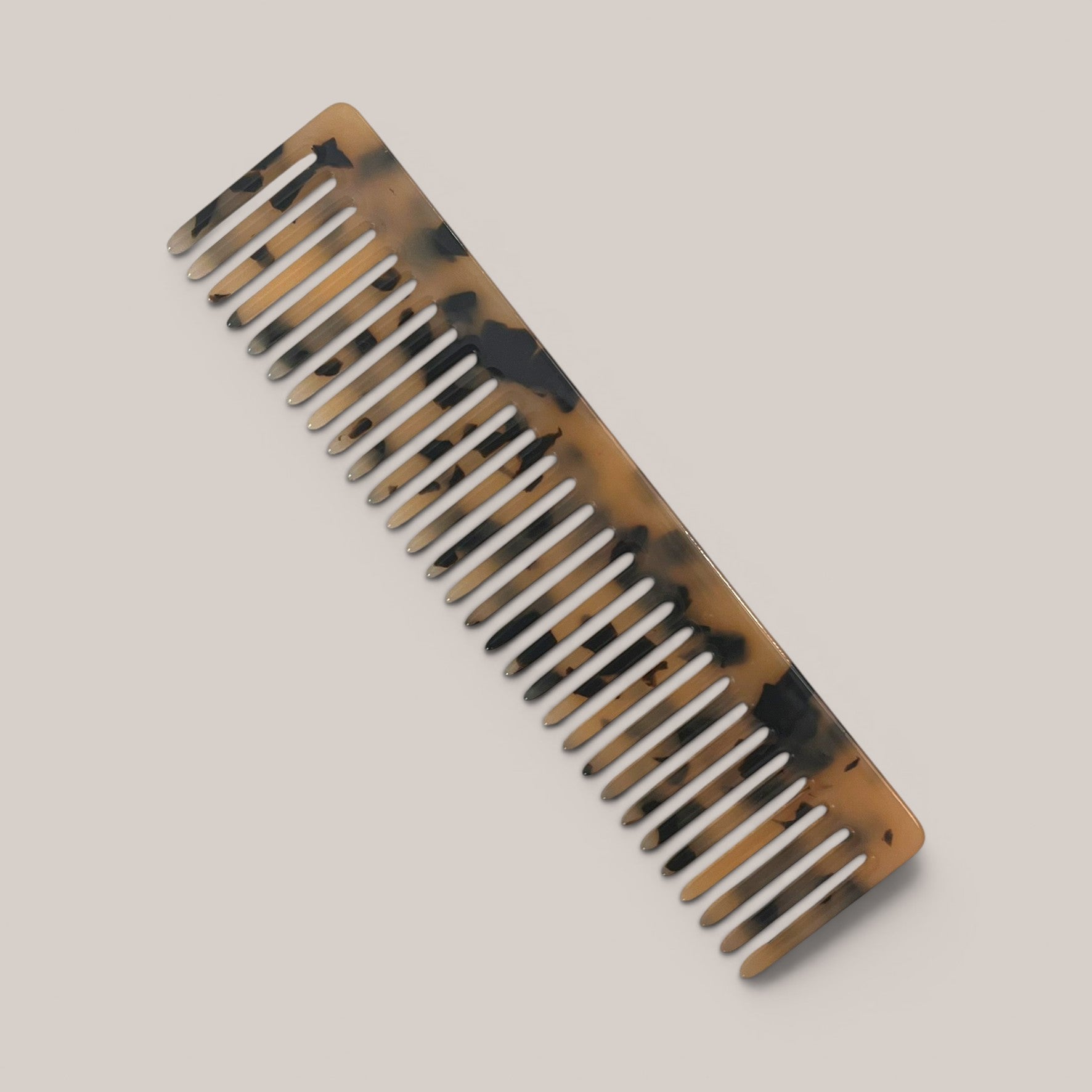 Signature acetate vanity comb in a polished marbled finish