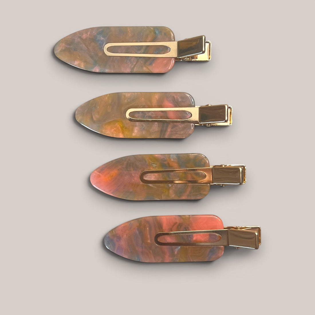 Set of four marbled no-crease hair clips with gold-tone clasps