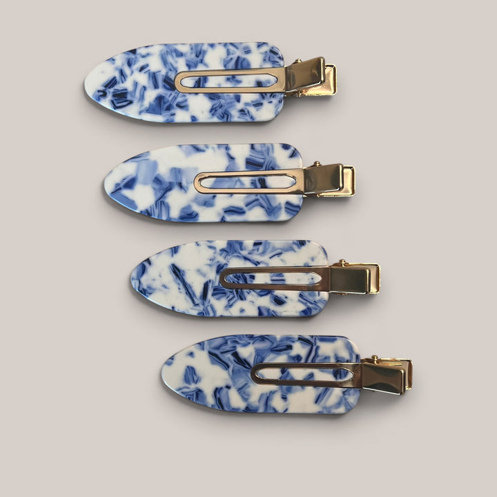 Set of four blue marble no-crease hair clips with gold-tone clasp