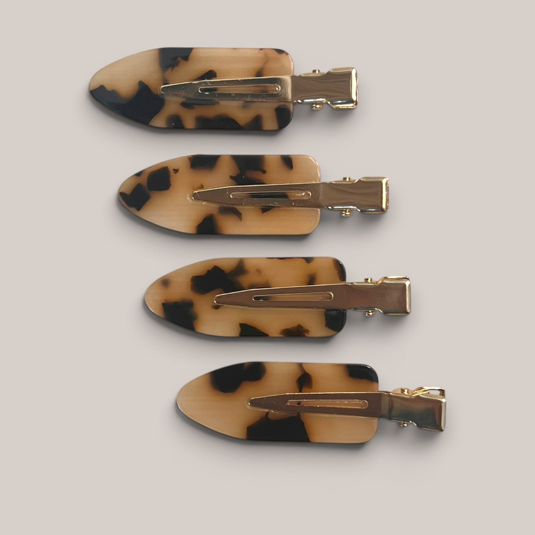 Set of four mini tortoise no-crease hair clips with gold-tone clasp
