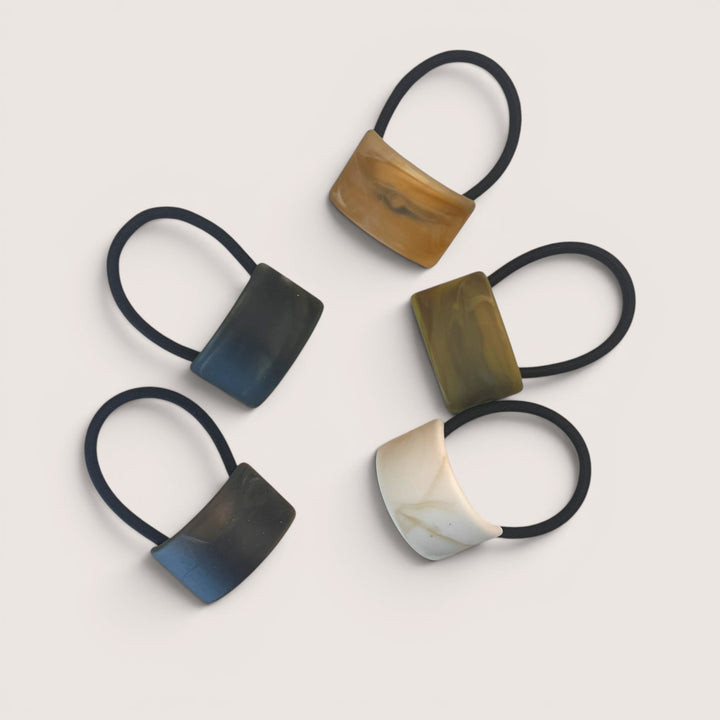 Assorted sculpted acetate ponytail holders with black elastic bands