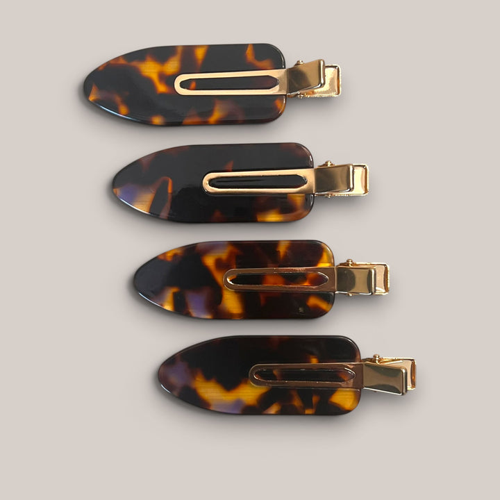 Set of four tortoise shell no-crease hair clips with gold-tone clasp